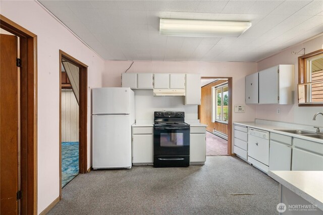 2507 Bay Ave, Hoquiam, WA 98550 - kitchen with white appliances, under cabinet range hood, and light countertops