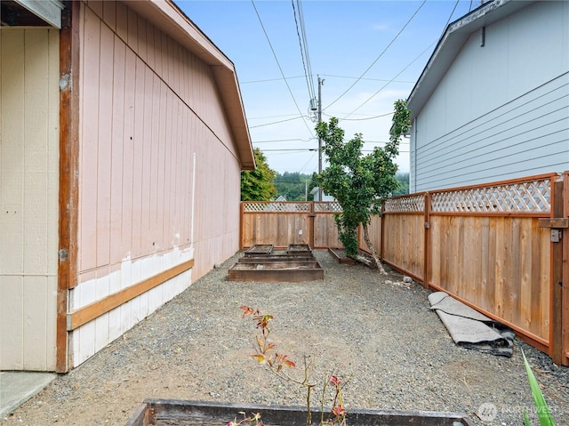 2507 Bay Ave, Hoquiam, WA 98550 - fenced backyard featuring a garden