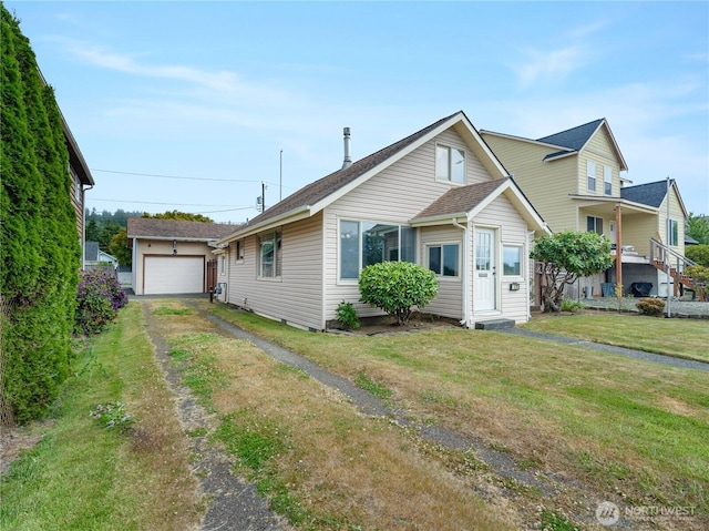 2507 Bay Ave, Hoquiam, WA 98550 - view of front of property with an outbuilding, a front yard, and roof with shingles