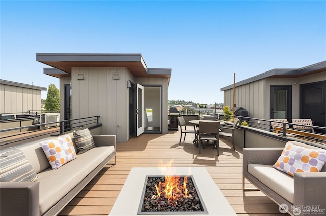 917 NW 51st St Unit D, Seattle, WA 98107 - wooden deck featuring an outdoor living space with a fire pit and outdoor dining space