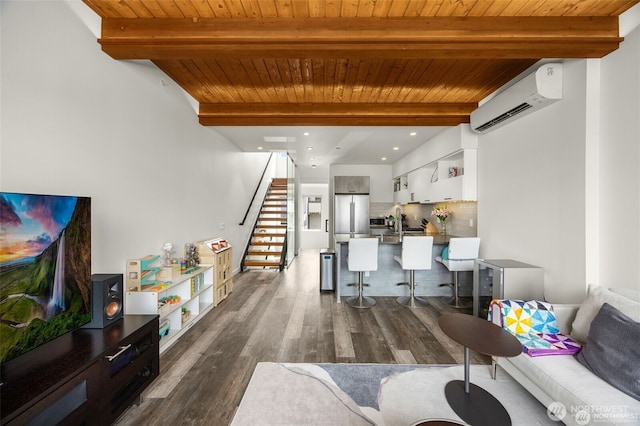 917 NW 51st St Unit D, Seattle, WA 98107 - living area featuring a wall mounted air conditioner, a wooden ceiling with exposed beams, stairs, and dark wood finished floors
