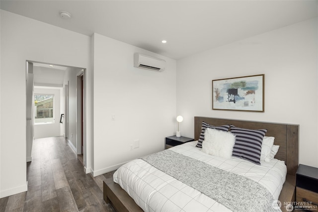 917 NW 51st St Unit D, Seattle, WA 98107 - bedroom featuring an AC wall unit, wood finished floors, and recessed lighting
