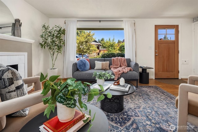 3033 48th Ave SW, Seattle, WA 98116 - living area with wood finished floors and a brick fireplace
