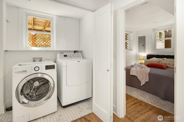 3033 48th Ave SW, Seattle, WA 98116 - laundry room with separate washer and dryer, electric panel, and light wood-style flooring