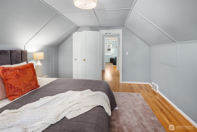 3033 48th Ave SW, Seattle, WA 98116 - bedroom featuring wood finished floors and lofted ceiling