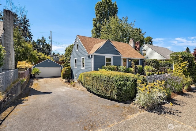 3033 48th Ave SW, Seattle, WA 98116 - view of front of home featuring a detached garage and an outbuilding