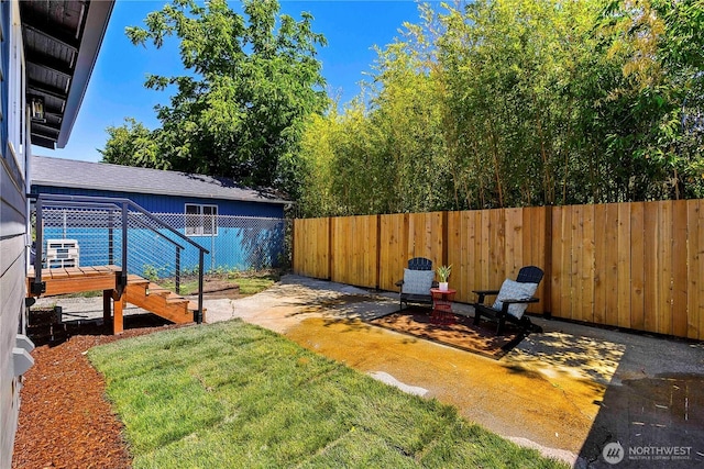 5310 46th Ave S, Seattle, WA 98118 - fenced backyard featuring a patio area