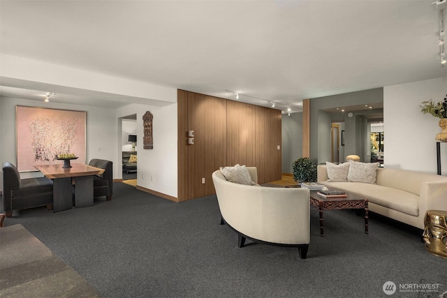 3650 26th Pl W Unit 202A, Seattle, WA 98199 - carpeted living room featuring rail lighting and baseboards