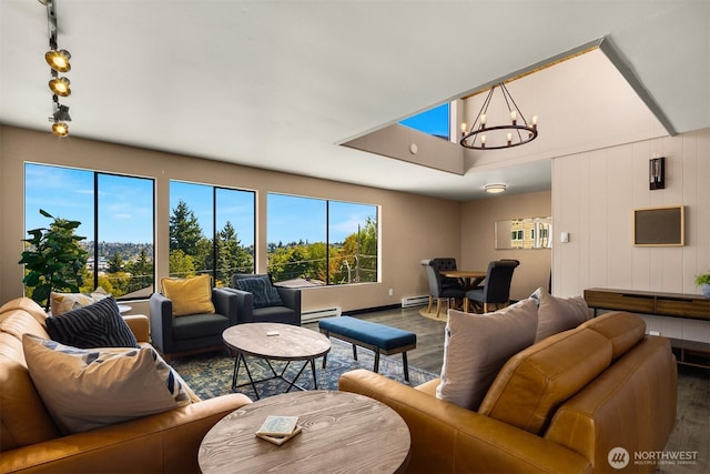 3650 26th Pl W Unit 202A, Seattle, WA 98199 - living area featuring wood finished floors, a chandelier, and healthy amount of natural light