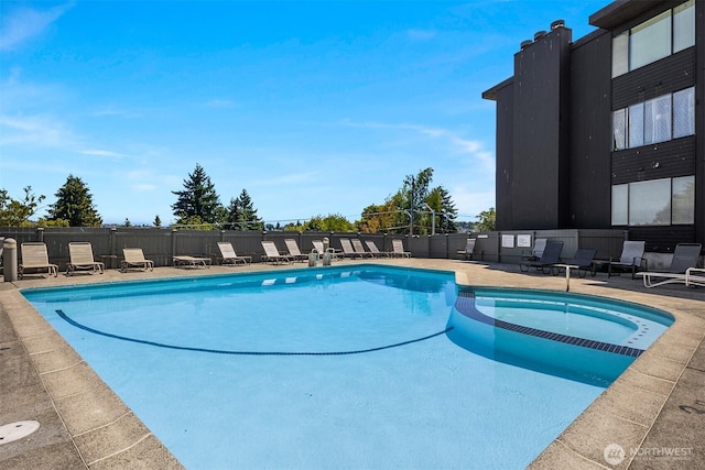 3650 26th Pl W Unit 202A, Seattle, WA 98199 - view of pool with a pool with connected hot tub and a patio