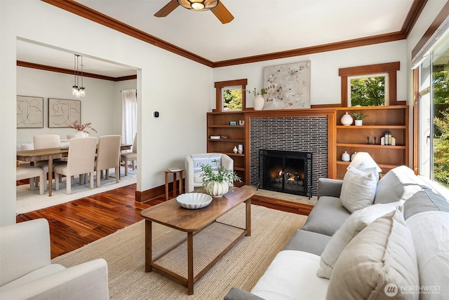5817 28th Ave NW, Seattle, WA 98107 - living area with wood finished floors, a tile fireplace, ceiling fan, and ornamental molding