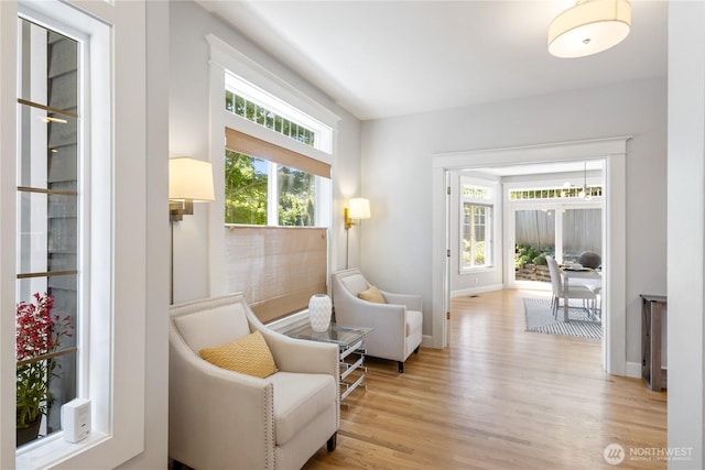 3055 49th Ave SW, Seattle, WA 98116 - living area featuring light wood-type flooring and baseboards