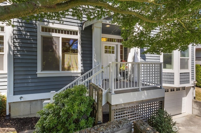 3055 49th Ave SW, Seattle, WA 98116 - wooden deck featuring a garage and concrete driveway
