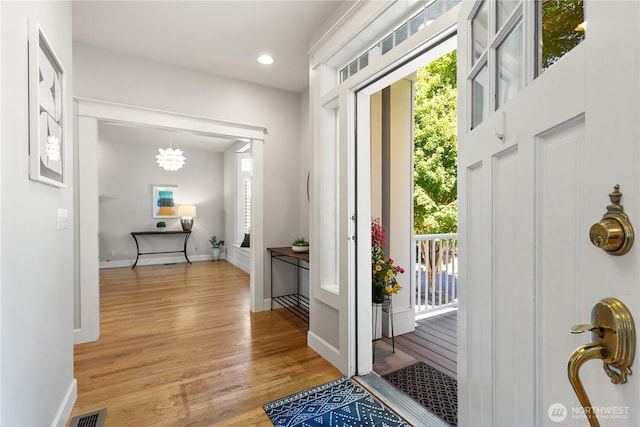 3055 49th Ave SW, Seattle, WA 98116 - foyer entrance with healthy amount of natural light, light wood-style floors, recessed lighting, and a chandelier