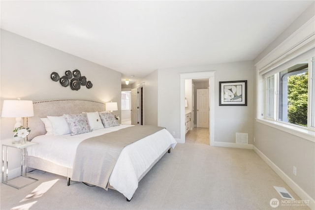 3055 49th Ave SW, Seattle, WA 98116 - bedroom featuring light carpet and ensuite bath