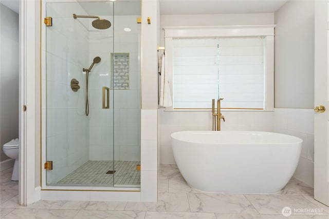 3055 49th Ave SW, Seattle, WA 98116 - full bath with a stall shower, a freestanding tub, and marble look tiles