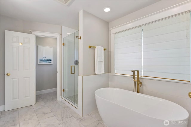 3055 49th Ave SW, Seattle, WA 98116 - full bathroom featuring marble look tile flooring, a freestanding bath, and a stall shower