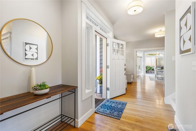3055 49th Ave SW, Seattle, WA 98116 - foyer entrance with light wood-style flooring and baseboards