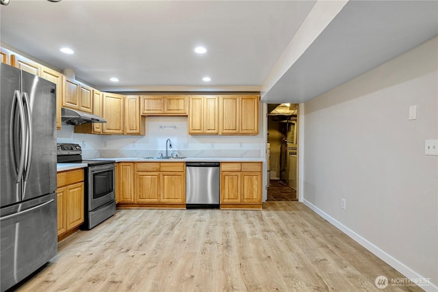 12621 SE 166th St, Renton, WA 98058 - kitchen with appliances with stainless steel finishes, under cabinet range hood, light wood-style flooring, light countertops, and recessed lighting