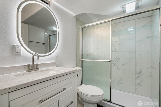 12621 SE 166th St, Renton, WA 98058 - bathroom featuring a textured wall, vanity, and a stall shower