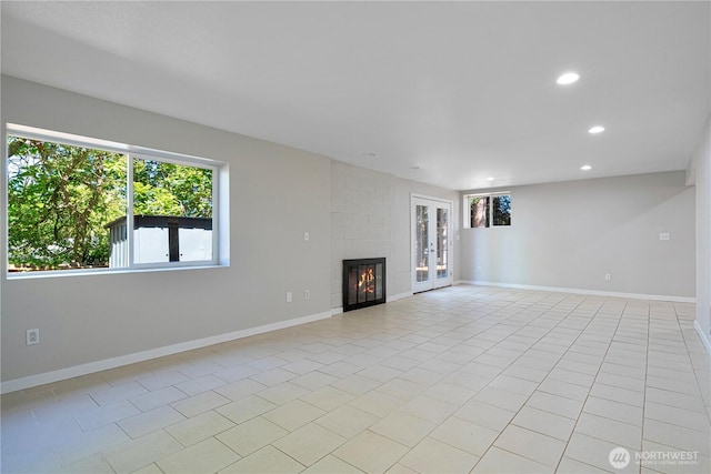 12621 SE 166th St, Renton, WA 98058 - unfurnished living room featuring a large fireplace, recessed lighting, and light tile patterned floors