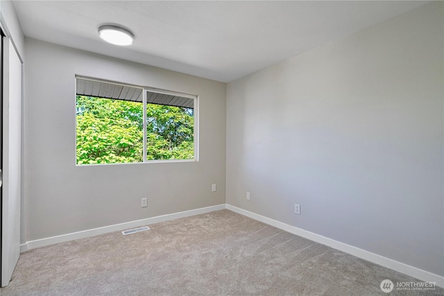 12621 SE 166th St, Renton, WA 98058 - carpeted spare room featuring baseboards