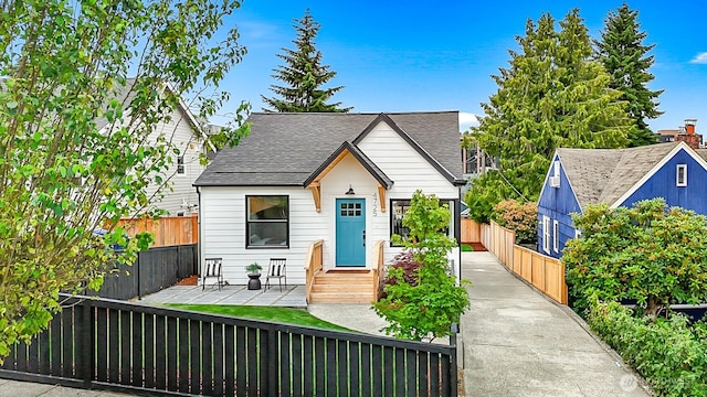 4725 37th Ave SW, Seattle, WA 98126 - bungalow-style house with a fenced front yard and a shingled roof