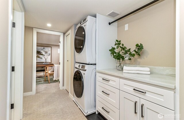 4725 37th Ave SW, Seattle, WA 98126 - washroom with stacked washer / dryer, cabinet space, carpet flooring, and recessed lighting
