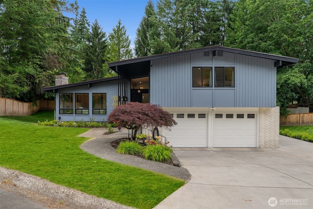 14821 117th Pl NE, Kirkland, WA 98034 - view of front of house with driveway, a garage, a chimney, and brick siding
