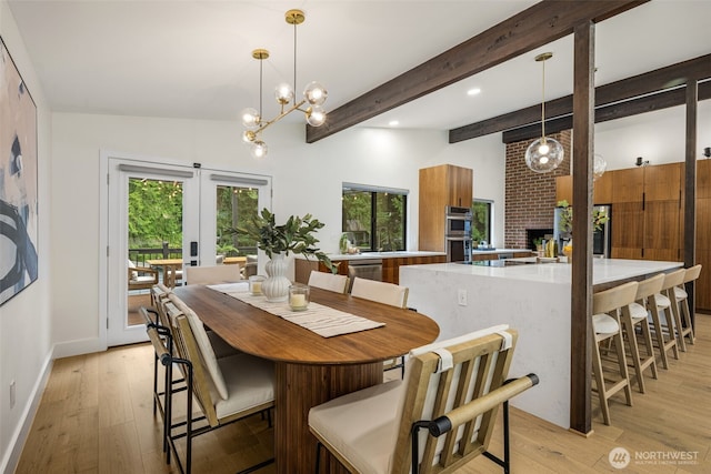 14821 117th Pl NE, Kirkland, WA 98034 - dining room with light wood-style flooring, a fireplace, beamed ceiling, french doors, and recessed lighting
