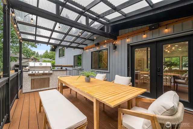 14821 117th Pl NE, Kirkland, WA 98034 - deck featuring an outdoor kitchen, outdoor dining area, and a pergola