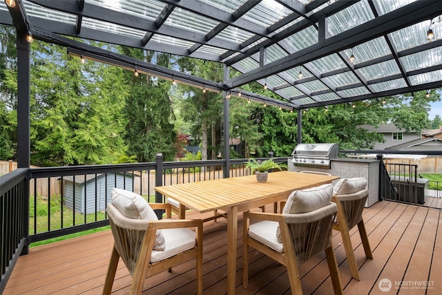 14821 117th Pl NE, Kirkland, WA 98034 - deck with outdoor dining space, a pergola, and an outdoor kitchen