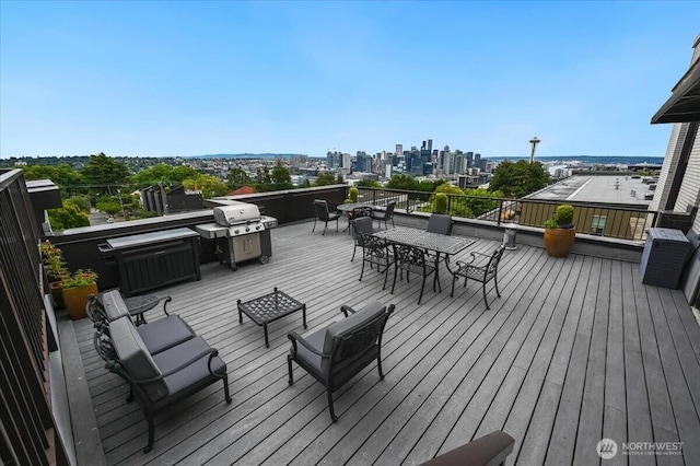 201 Galer St Unit 362, Seattle, WA 98109 - deck with a view of skyline, outdoor dining area, and a grill