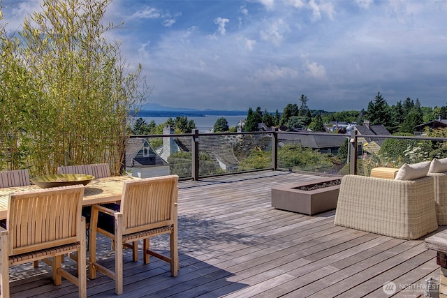3006 43rd Ave W, Seattle, WA 98199 - wooden deck with a water view and an outdoor fire pit
