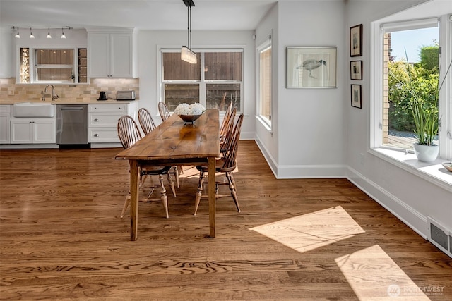 3006 43rd Ave W, Seattle, WA 98199 - dining area with healthy amount of natural light and dark wood finished floors