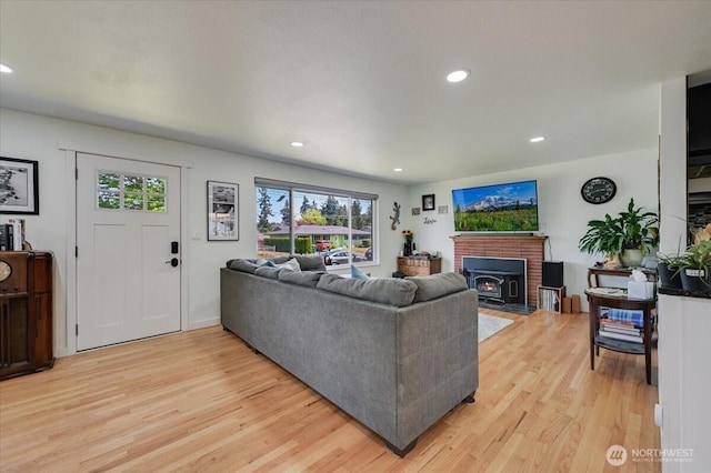 701 Mountain View Dr, Mount Vernon, WA 98273 - living area featuring light wood finished floors, plenty of natural light, a wood stove, and recessed lighting
