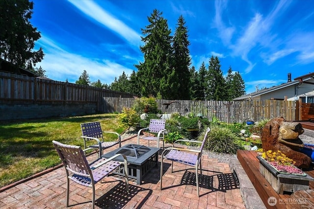 701 Mountain View Dr, Mount Vernon, WA 98273 - fenced backyard with a patio and a fire pit