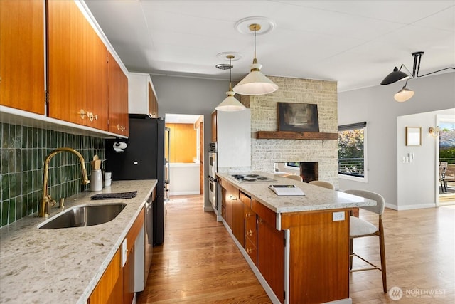 8733 21st Ave NW, Seattle, WA 98117 - kitchen with decorative backsplash, brown cabinetry, and a breakfast bar