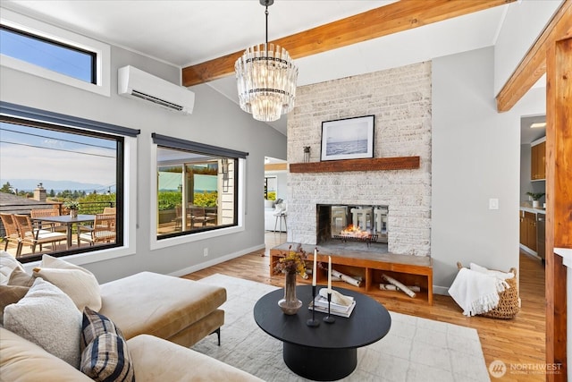 8733 21st Ave NW, Seattle, WA 98117 - living area featuring an AC wall unit, beam ceiling, a multi sided fireplace, wood finished floors, and a chandelier