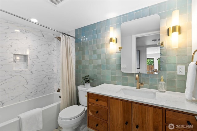 8733 21st Ave NW, Seattle, WA 98117 - bathroom featuring tile walls, vanity, shower / tub combo, and decorative backsplash