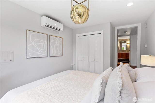 8733 21st Ave NW, Seattle, WA 98117 - bedroom featuring an AC wall unit, a closet, and recessed lighting