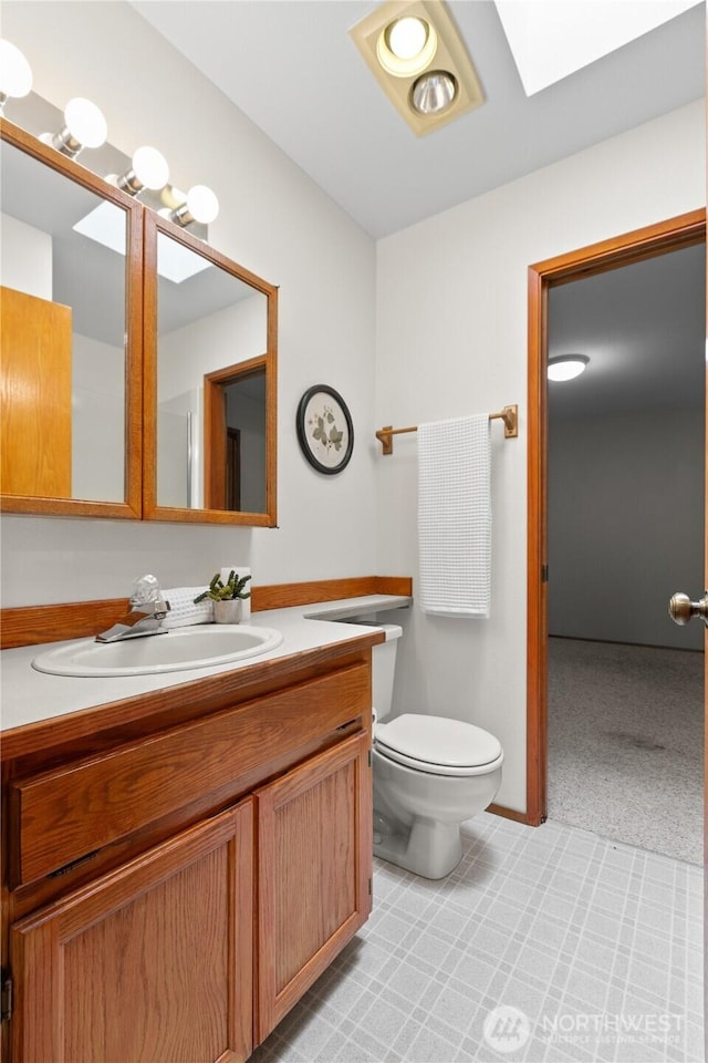 4867 N Village Ln, Bellingham, WA 98226 - bathroom with vanity, a skylight, and tile patterned floors