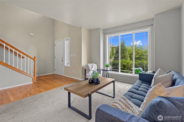 10873 SE 214th Pl, Kent, WA 98031 - carpeted living room featuring stairs and wood finished floors