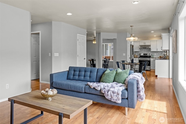 10873 SE 214th Pl, Kent, WA 98031 - living area with light wood-style flooring, a ceiling fan, plenty of natural light, and recessed lighting