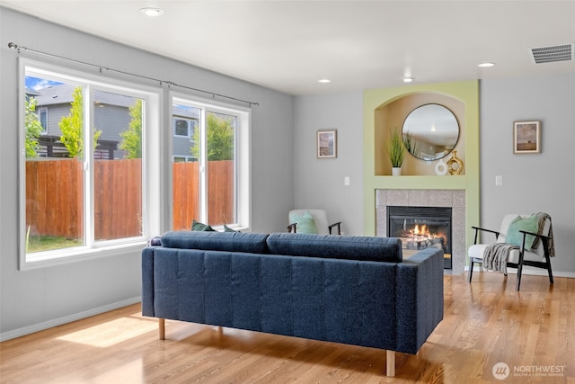 10873 SE 214th Pl, Kent, WA 98031 - living room featuring wood finished floors, a tiled fireplace, and recessed lighting