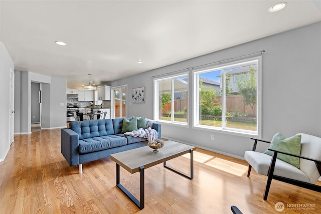 10873 SE 214th Pl, Kent, WA 98031 - living area with light wood-style floors and recessed lighting