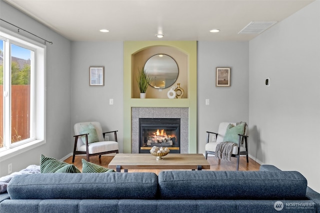 10873 SE 214th Pl, Kent, WA 98031 - living area featuring wood finished floors, a tiled fireplace, and recessed lighting