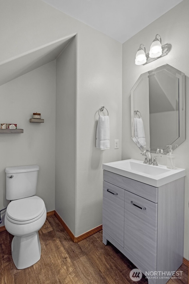 10873 SE 214th Pl, Kent, WA 98031 - bathroom with vanity, wood finished floors, and lofted ceiling