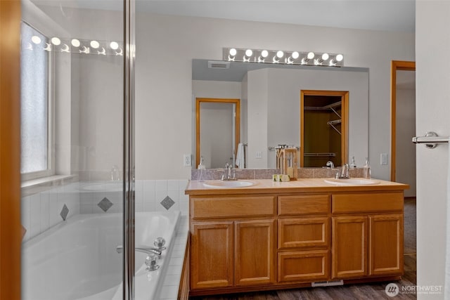 10873 SE 214th Pl, Kent, WA 98031 - bathroom with double vanity, a tub to relax in, and an enclosed shower