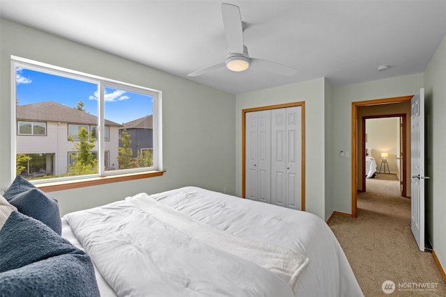 10873 SE 214th Pl, Kent, WA 98031 - bedroom with carpet, a ceiling fan, and a closet